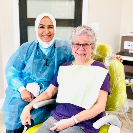 Senior woman smiling during visit with periodontist in Mount Prospect