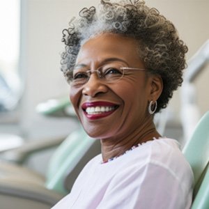smiling woman in a dentist’s chair 