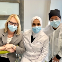 Doctor Khan and two periodontal team members wearing face masks